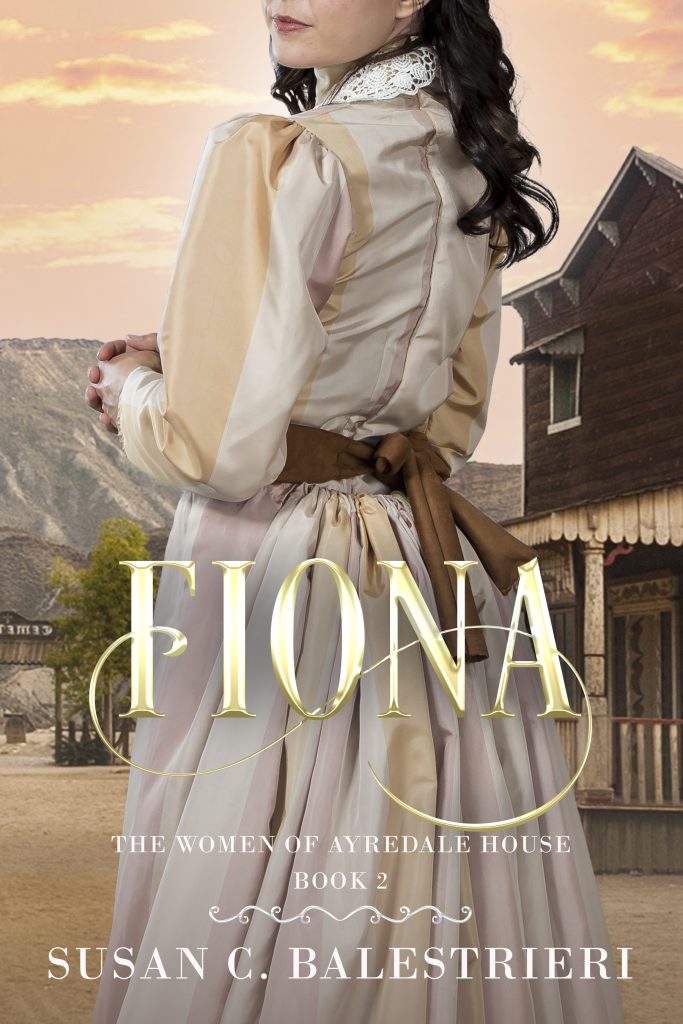 A woman in a fancy western-style dress stands centered with her back to the viewer. Behind her is a western scene with a mountain and an 1800s storefront. It's titled "Fiona" and the series is "The Women of Ayredale House, Book 2"